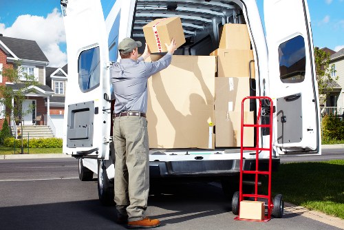 Packed boxes and furniture ready for storage in Alperton